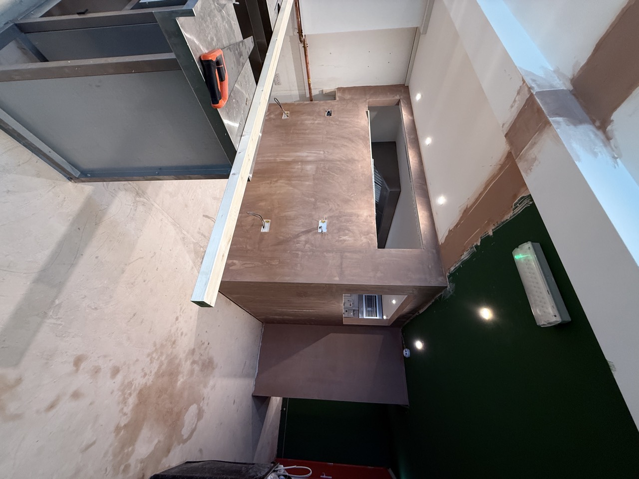 The stainless extraction canopy fitted over the open kitchen.